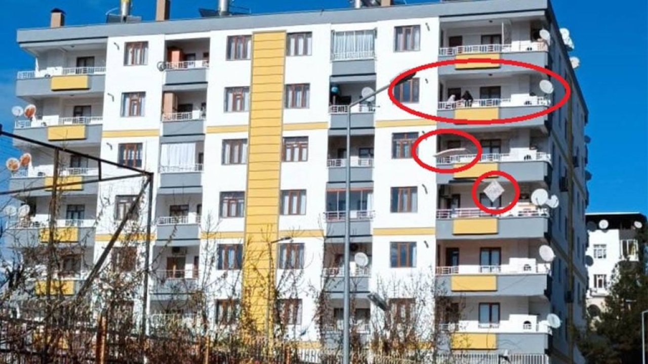Hasarlı binaya girip, eşyalarını balkondan atarak kurtarmaya çalıştı