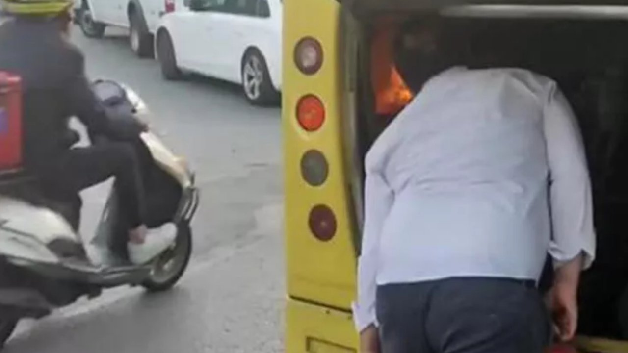 Otobüsün yanan motorunu üfleyerek söndürmeye çalıştı