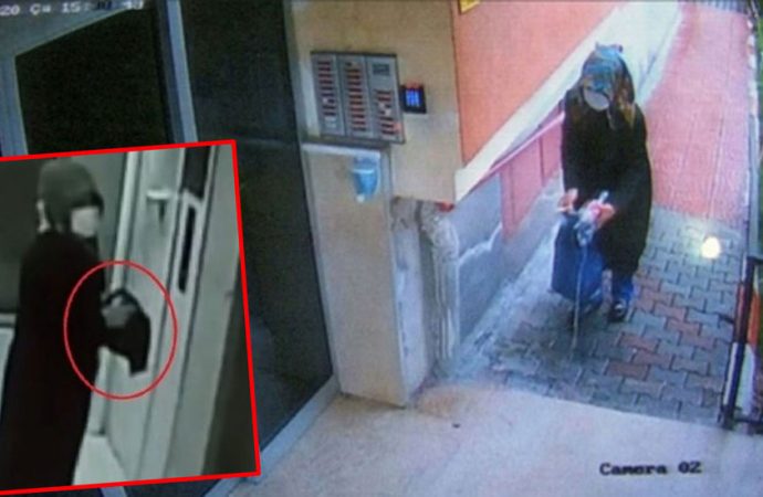 Yüzü maskeli kadın binalara girip elindeki sıvıyı her yere sürdü