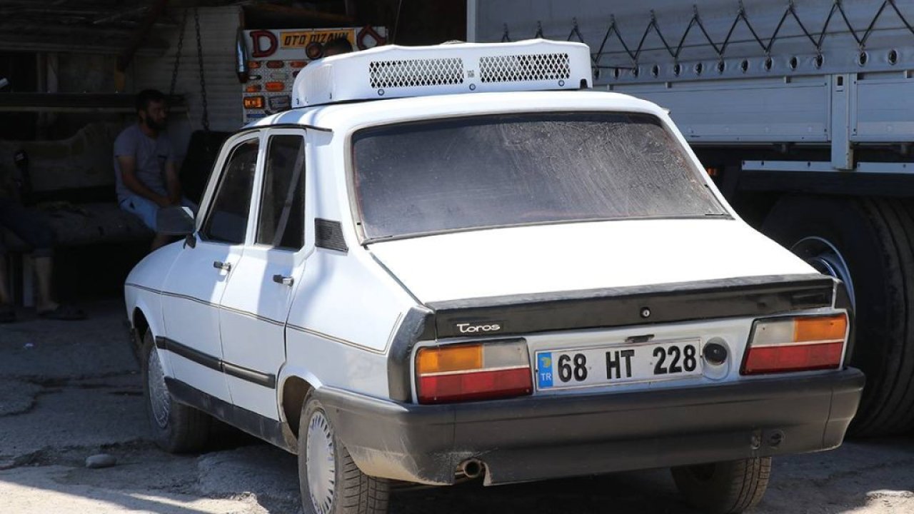 Adana'da sıcaktan bunalan esnaf 1991 model aracına klima taktı
